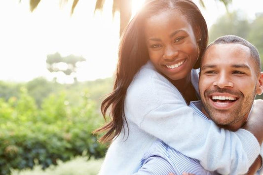 Person smiling and feeling confident during intimate moments. Individual exploring ways to enhance sexual enjoyment.
