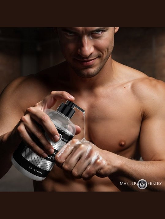 Man applying body wash to his hands with a visible brand logo.