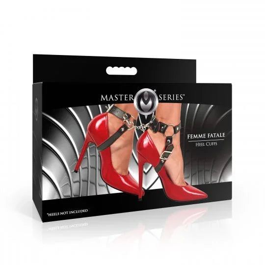 Box of Master Series Femme Fatale Heel Clips with red high heels and black harness on a white background