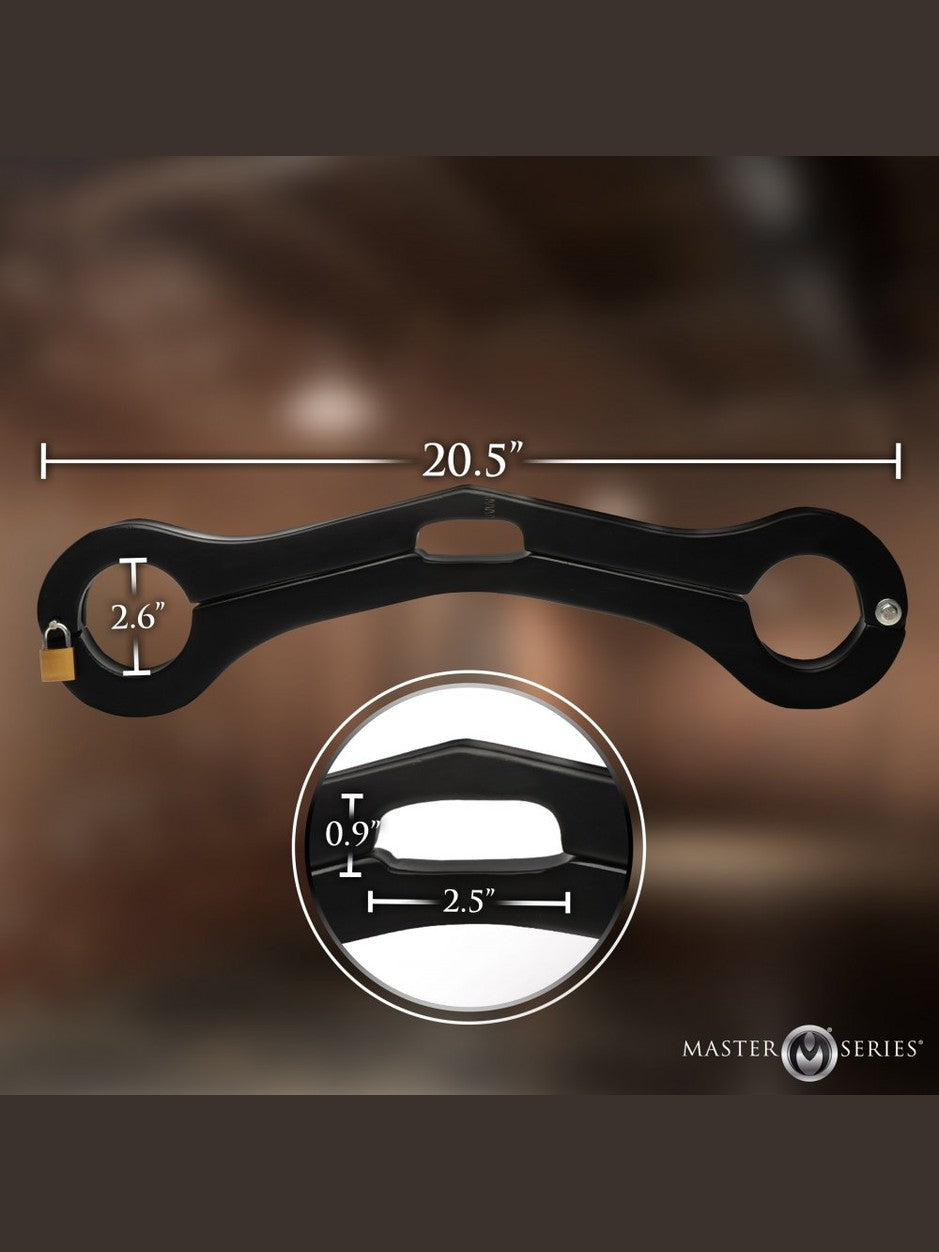 Black metal linkage with measurements on a blurred background