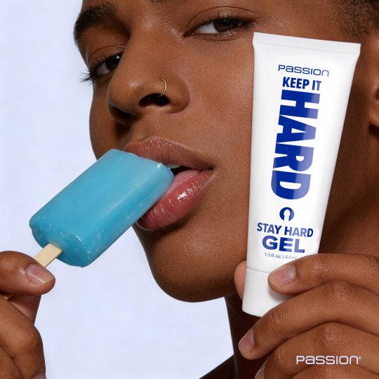 Person holding a blue popsicle and a tube of 'Stay Hard Gel' with 'Passion' branding.