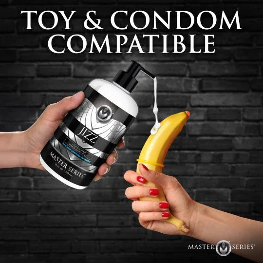 Hand holding a bottle labeled 'Jazz' with a banana, against a dark brick wall background.
