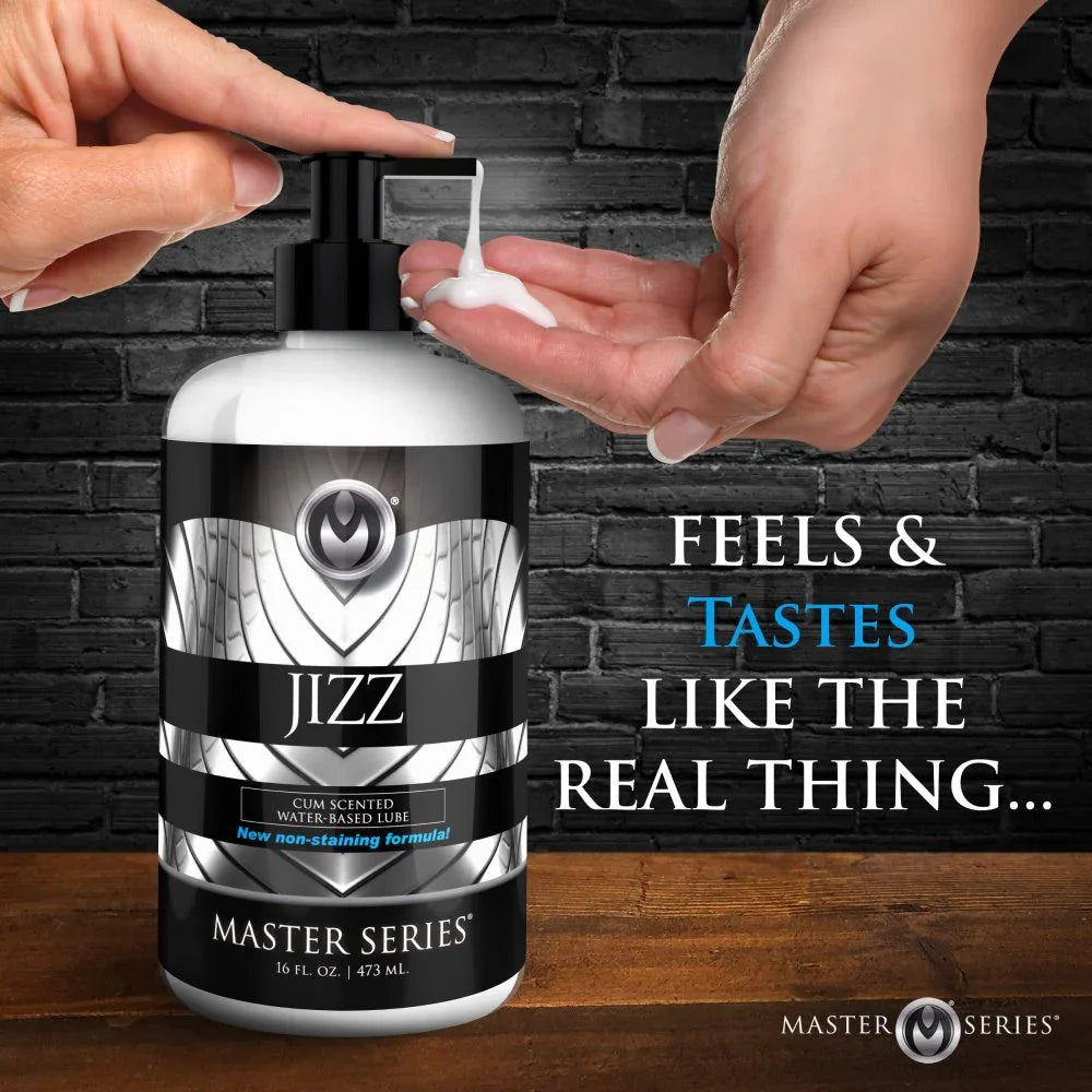 Bottle of Master Series Jizz product with hands applying cream against a brick wall background.