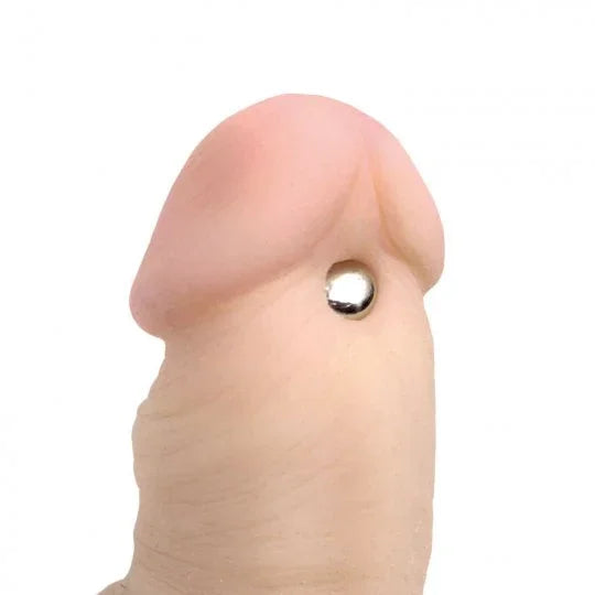 Realistic silicone breast with a silver implant on a white background