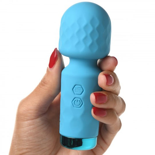 Blue handheld device held by a hand with red nail polish on a white background