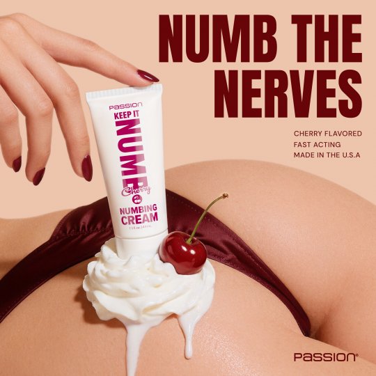 Numbing cream tube with cherry flavor on a cream-covered surface, labeled 'Passion Keep It Nume'.