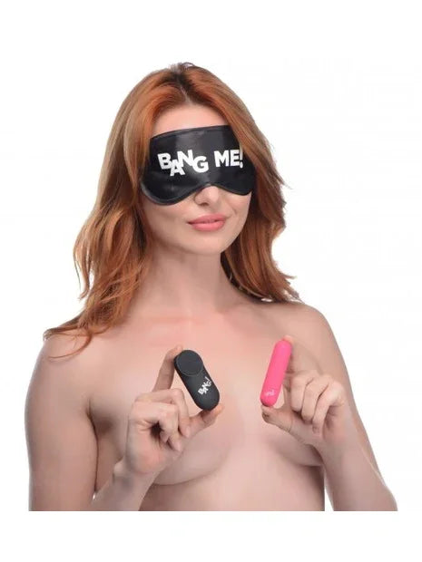 Woman wearing a 'Bang Me' mask holding two toys on a white background