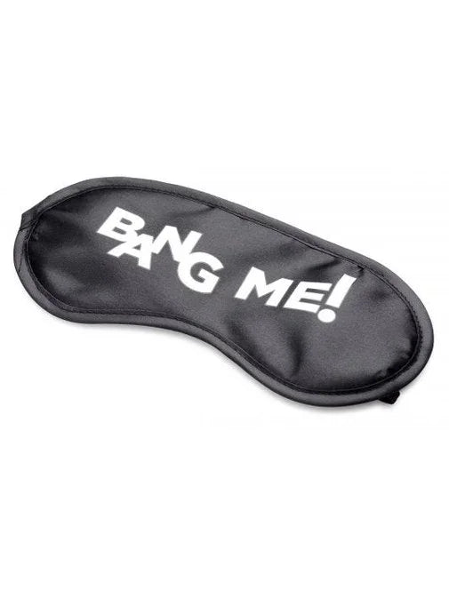 Black sleep mask with 'Bang Me!' text on a white background