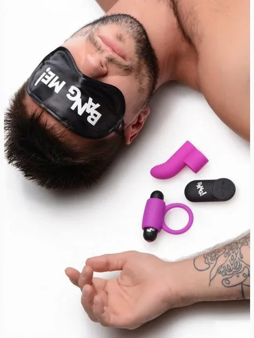 Man wearing a 'Bang Me' mask with pink and black sex toys on a white background