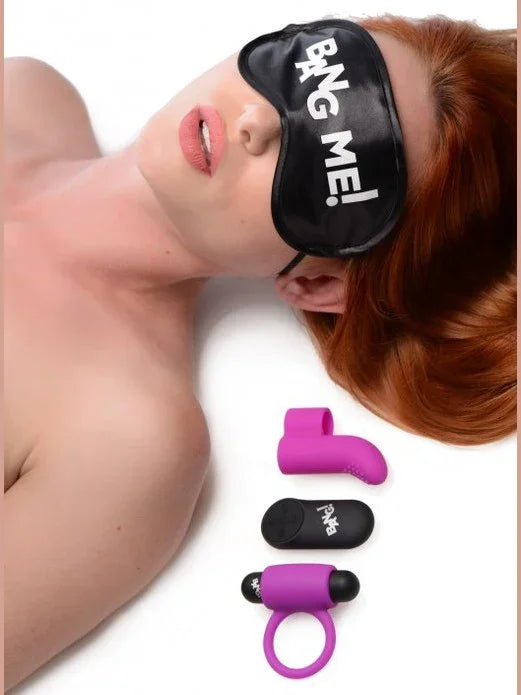 Person wearing a 'Bang Me!' sleep mask with purple and black items on a white background