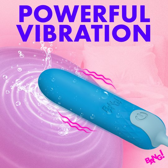 A blue and light blue personal massager shown diagonally over a pink water-splashed background with large purple text reading 'POWERFUL VIBRATION' and a small 'BANG!' logo in the corner.