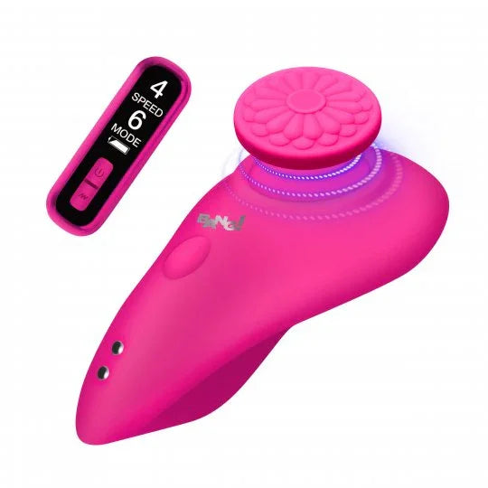 Pink electronic device with remote control on a white background