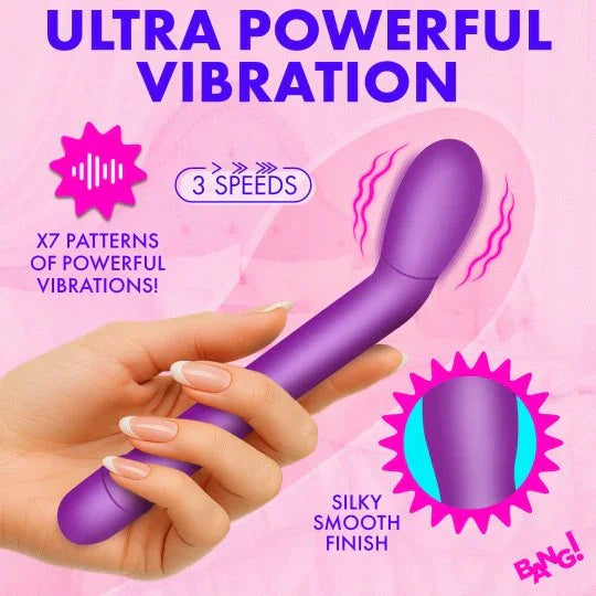Purple handheld vibrator with text on a pink background